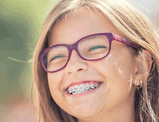 A child smiling with braces